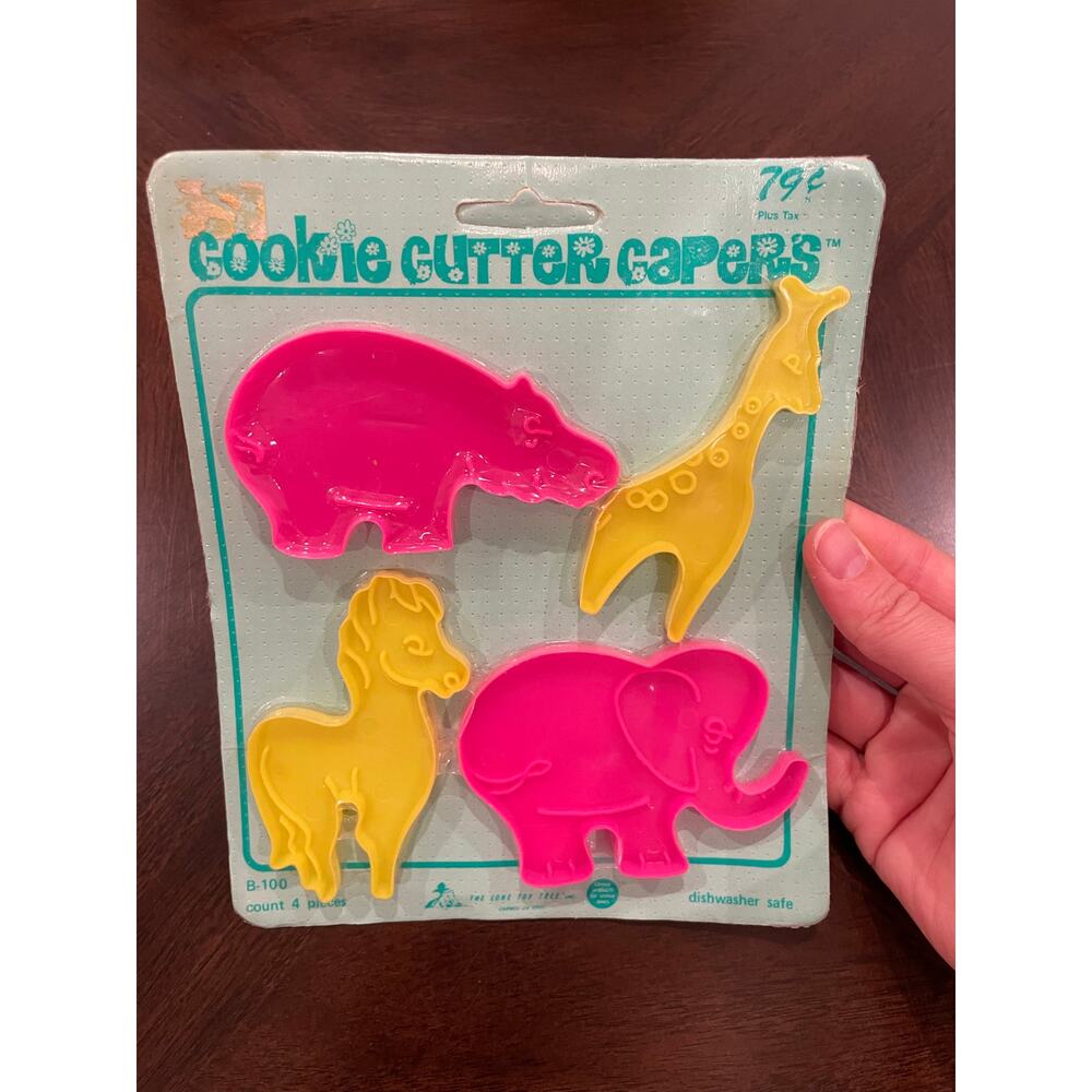 Set of 4 vintage “Cookie Cutter Capers" cookie cutters